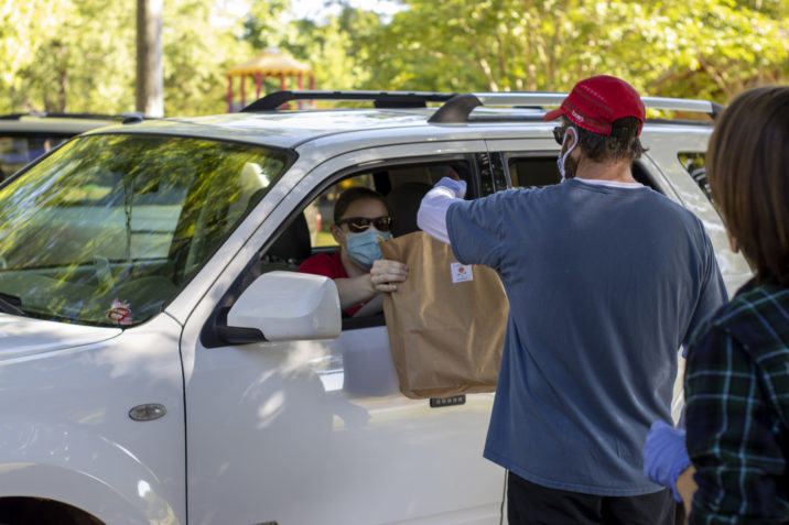 Volunteer delivering food