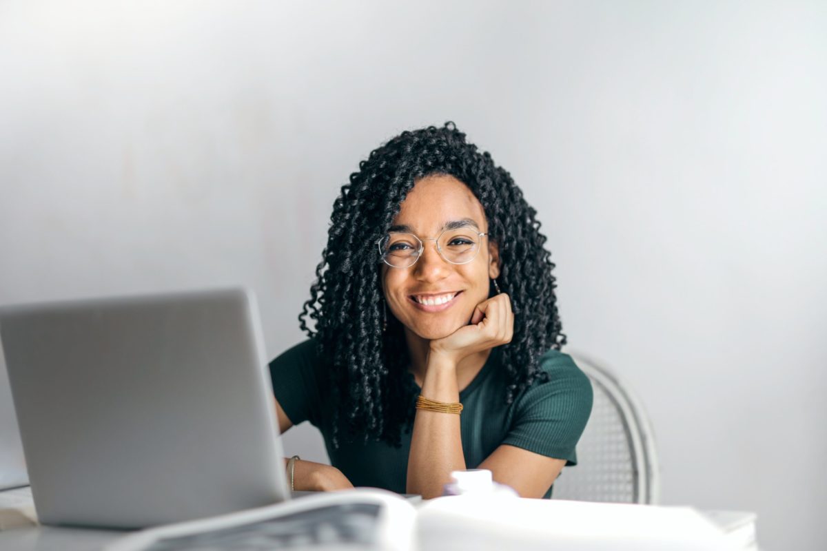 Girl using laptop smiling
